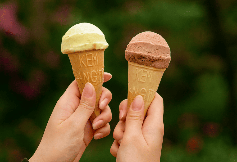 Take a peaceful night stroll around Hoan Kiem Lake and end the day with a nostalgic Kem Trang Tien